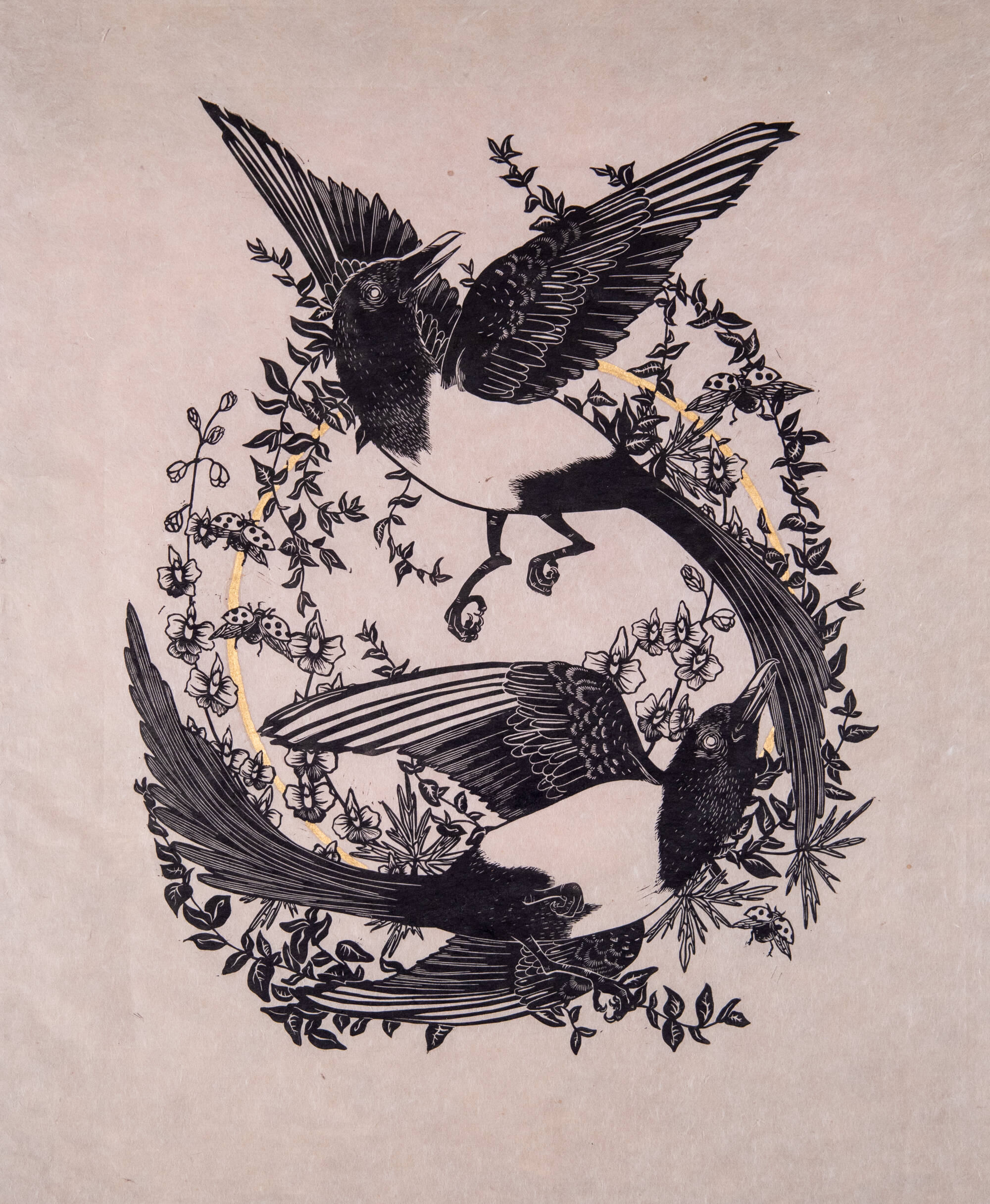 Black and white print of two birds circled around each other with floral vines.